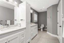 Shared family bathroom with two sinks upper level - 