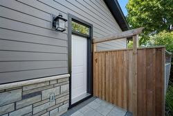 Side entrance to garage with stone walkway from driveway - 