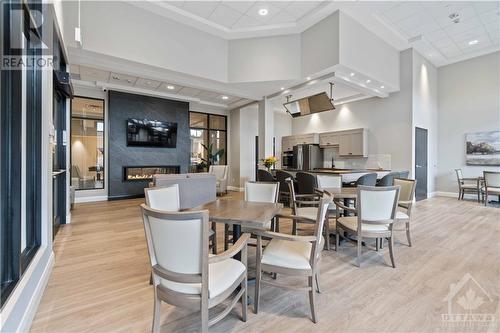 Shared entertainment space - 31 Eric Devlin Lane Unit#312, Perth, ON - Indoor Photo Showing Dining Room With Fireplace