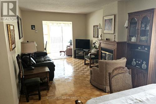 103 - 54 Fittons Road W, Orillia, ON - Indoor Photo Showing Living Room With Fireplace