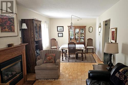 103 - 54 Fittons Road W, Orillia, ON - Indoor Photo Showing Living Room With Fireplace