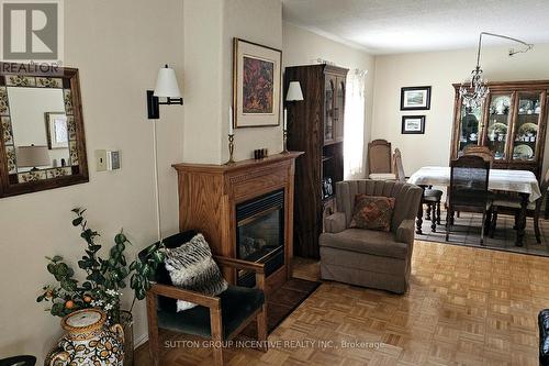 103 - 54 Fittons Road W, Orillia, ON - Indoor Photo Showing Living Room With Fireplace