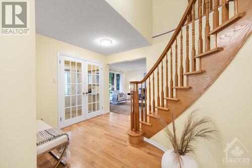 Hallway featuring double french doors to the foyer. - 21 Keys Way, Ottawa, ON - Indoor Photo Showing Other Room