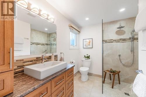 Spa-like ensuite include heated floors, walk-in shower and lots of cabinets for storage. - 21 Keys Way, Ottawa, ON - Indoor Photo Showing Bathroom