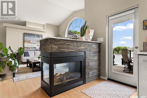 3156 Wimbledon Bay, Regina, SK - Indoor Photo Showing Living Room With Fireplace