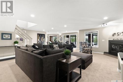 3156 Wimbledon Bay, Regina, SK - Indoor Photo Showing Living Room With Fireplace