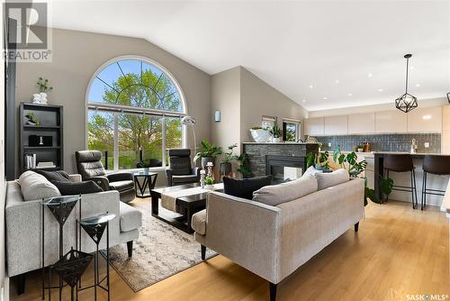 3156 Wimbledon Bay, Regina, SK - Indoor Photo Showing Living Room With Fireplace
