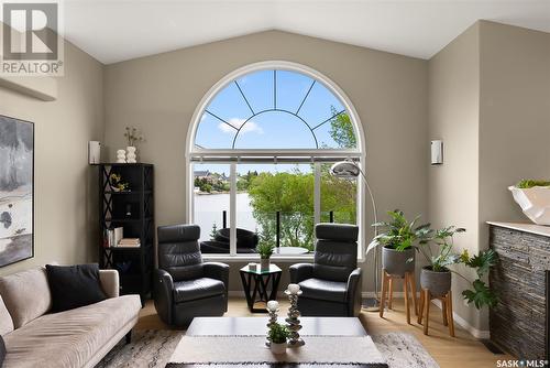 3156 Wimbledon Bay, Regina, SK - Indoor Photo Showing Living Room With Fireplace