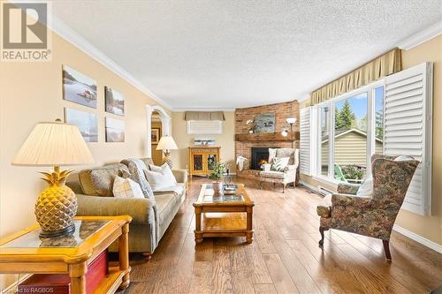 Breathtaking views from all principal rooms ensure you are always connected to the beauty of the bay. - 11, 13, 19 C Lane, Collingwood, ON - Indoor Photo Showing Living Room With Fireplace