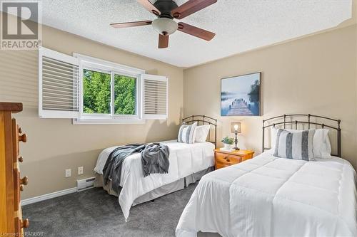 This exquisite home features four bedrooms and two full bathrooms, providing ample space for family and guests. - 11, 13, 19 C Lane, Collingwood, ON - Indoor Photo Showing Bedroom
