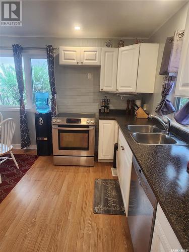 101 Centre Street, Frontier, SK - Indoor Photo Showing Kitchen With Double Sink