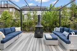 Large composite deck with pergola, large cedars provide privacy - 