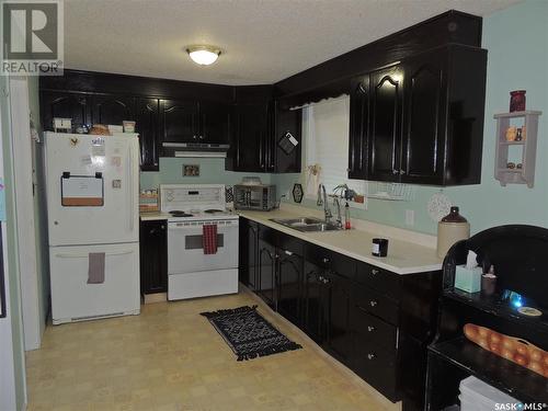 801 King Street, Estevan, SK - Indoor Photo Showing Kitchen With Double Sink