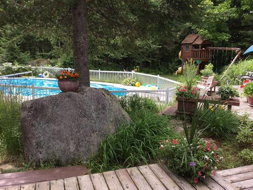 Cour - 12 Place D'Artois, Estérel, QC - Outdoor With In Ground Pool With Backyard