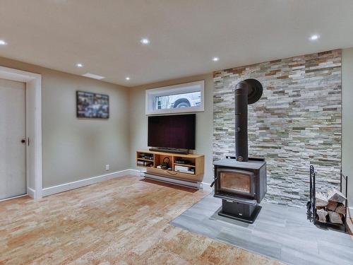 Family room - 1074 Rue Mathieu, Saint-Jérôme, QC - Indoor Photo Showing Living Room With Fireplace