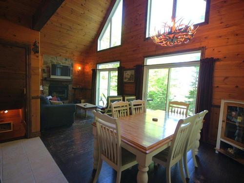 Vue d'ensemble - 230 Rue Du Sommet, Entrelacs, QC - Indoor Photo Showing Dining Room With Fireplace