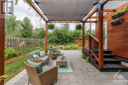 Enjoy summer nights on your 28x16 ft oversized interlock patio with custom cedar gazebo. - 87 Ida Street S, Arnprior, ON - Outdoor With Deck Patio Veranda With Exterior