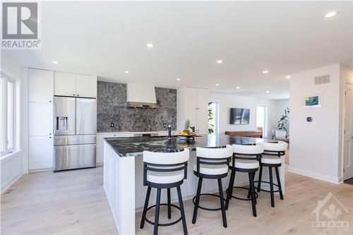 Stunning open concept main floor layout. You'll be wowed by the custom 9'X6' single slab Brazilian soapstone custom island complete with an eat-up area. - 87 Ida Street S, Arnprior, ON - Indoor