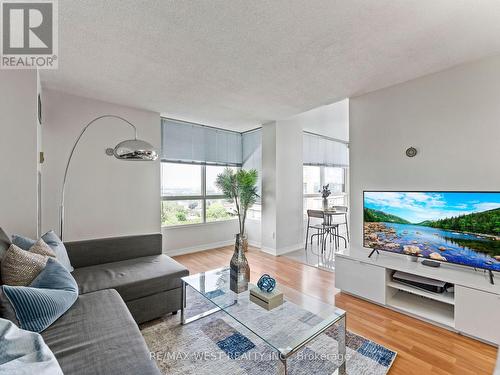 806 - 2470 Eglinton Avenue W, Toronto, ON - Indoor Photo Showing Living Room