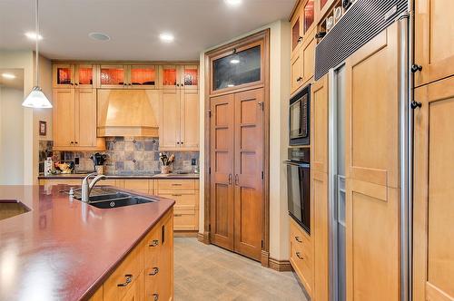 1306 Huckleberry Road, Kelowna, BC - Indoor Photo Showing Kitchen With Double Sink