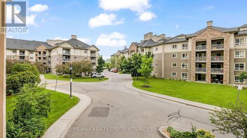 205 - 7 Dayspring Circle, Brampton, ON - Outdoor With Balcony With Facade