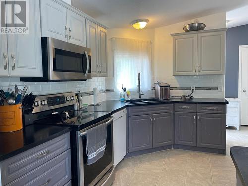 166 Mcconachie Creek Road, Fort Nelson, BC - Indoor Photo Showing Kitchen With Double Sink