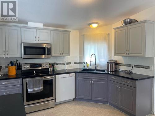 166 Mcconachie Creek Road, Fort Nelson, BC - Indoor Photo Showing Kitchen With Double Sink