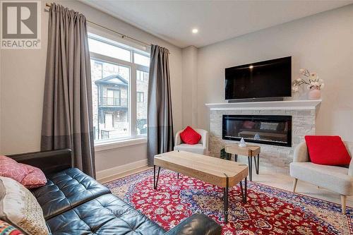 17 - 2610 Kettering Place, London, ON - Indoor Photo Showing Living Room With Fireplace