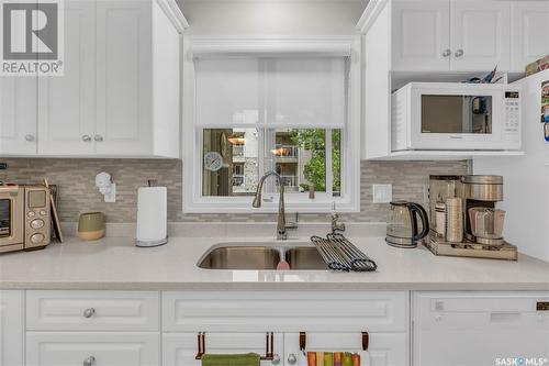 107 4525 Marigold Drive, Regina, SK - Indoor Photo Showing Kitchen With Double Sink