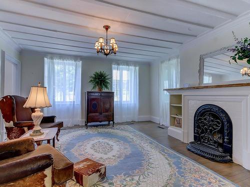 Salon - 411 Ch. Des Moulins, Mont-Saint-Hilaire, QC - Indoor Photo Showing Living Room With Fireplace