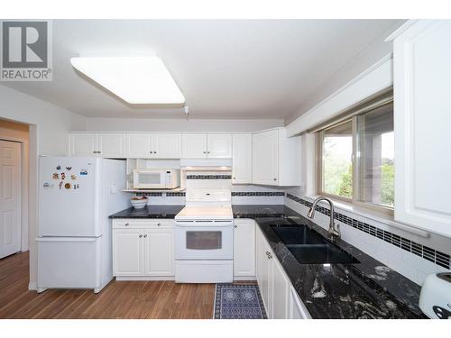 2130 Vasile Road Unit# 307, Kelowna, BC - Indoor Photo Showing Kitchen With Double Sink