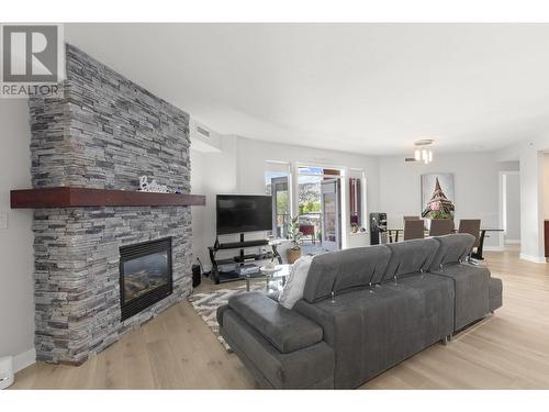 1160 Bernard Avenue Unit# 305, Kelowna, BC - Indoor Photo Showing Living Room With Fireplace