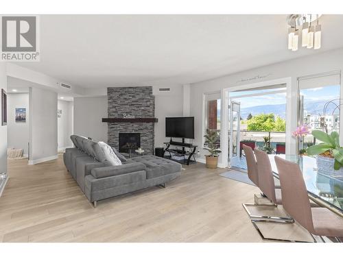 1160 Bernard Avenue Unit# 305, Kelowna, BC - Indoor Photo Showing Other Room With Fireplace