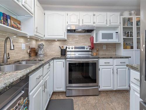 302-1217 Pandora Ave, Victoria, BC - Indoor Photo Showing Kitchen With Double Sink