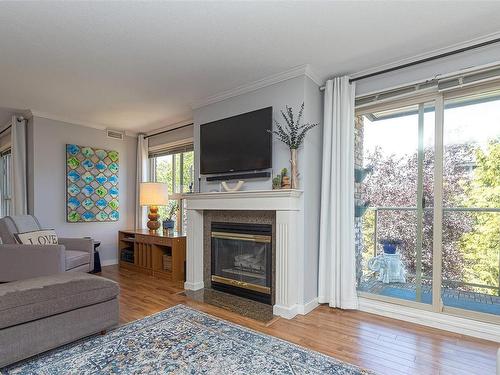 302-1217 Pandora Ave, Victoria, BC - Indoor Photo Showing Living Room With Fireplace