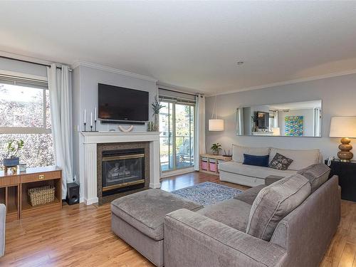 302-1217 Pandora Ave, Victoria, BC - Indoor Photo Showing Living Room With Fireplace