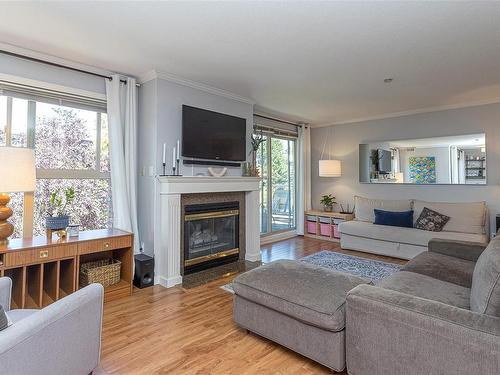 302-1217 Pandora Ave, Victoria, BC - Indoor Photo Showing Living Room With Fireplace