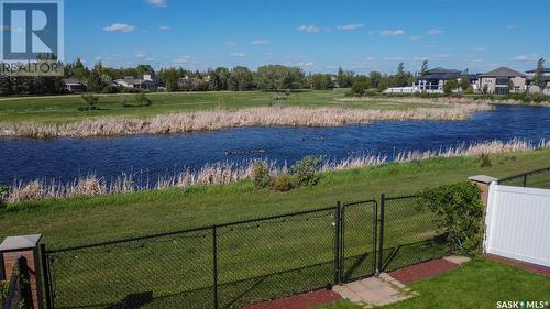 8247 Fairways West Drive, Regina, SK - Outdoor With Body Of Water With Deck Patio Veranda With Facade