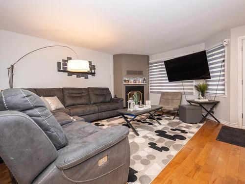 Salon - 1659  - 1661 Rue Notre-Dame-De-Fatima, Laval (Duvernay), QC - Indoor Photo Showing Living Room With Fireplace