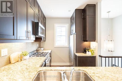 1402A Eglinton Avenue W, Toronto, ON - Indoor Photo Showing Kitchen With Double Sink