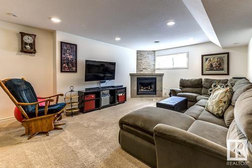 2049 69A St Sw, Edmonton, AB - Indoor Photo Showing Living Room With Fireplace