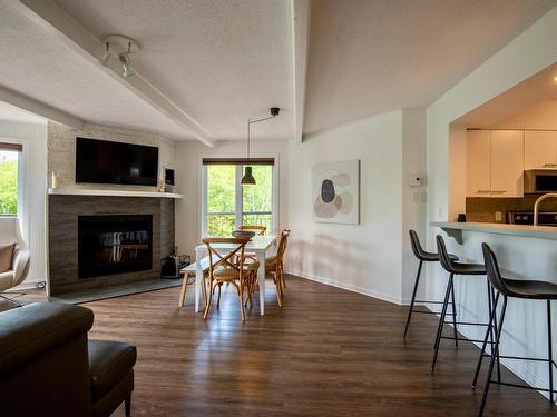 Salle Ã  manger - 334-113 Rue Cuttle, Mont-Tremblant, QC - Indoor Photo Showing Living Room With Fireplace