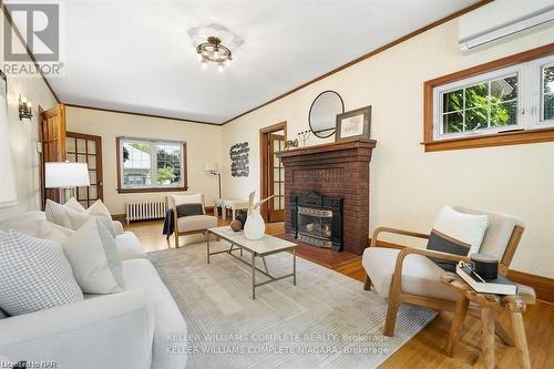 3855 St James Avenue, Niagara Falls, ON - Indoor Photo Showing Living Room With Fireplace