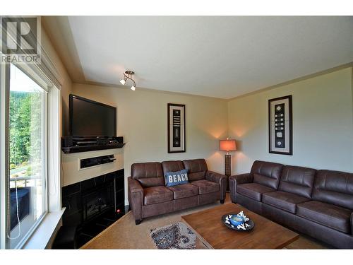 3460 Parkway Road Unit# A202 Lot# Mabel Lake, Enderby, BC - Indoor Photo Showing Living Room With Fireplace