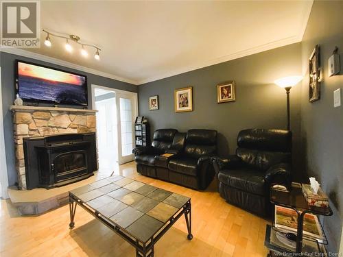 37 Cloutier Street, Saint-Jacques, NB - Indoor Photo Showing Living Room With Fireplace