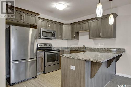 323 1715 Badham Boulevard, Regina, SK - Indoor Photo Showing Kitchen With Stainless Steel Kitchen