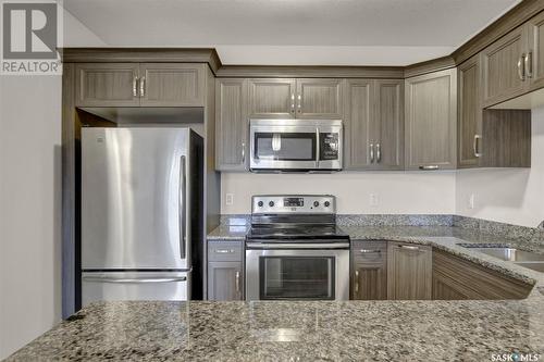 323 1715 Badham Boulevard, Regina, SK - Indoor Photo Showing Kitchen With Stainless Steel Kitchen With Upgraded Kitchen