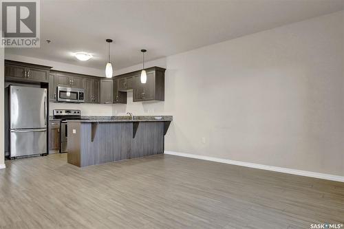 323 1715 Badham Boulevard, Regina, SK - Indoor Photo Showing Kitchen With Stainless Steel Kitchen With Upgraded Kitchen