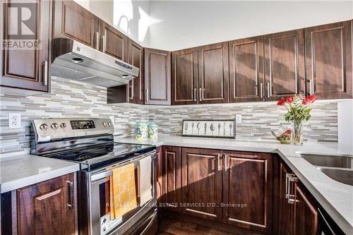 18 - 840 Dundas Street W, Mississauga, ON - Indoor Photo Showing Kitchen With Double Sink With Upgraded Kitchen