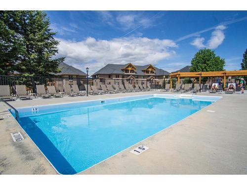 513 - 500 Bighorn Boulevard, Radium Hot Springs, BC - Outdoor With In Ground Pool With Backyard